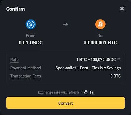 英文界面的闪兑确认框:0.01 USDC 换 0.0000001 BTC,报价 1 BTC 等于 100,070 USDC,交易手续费 0 BTC,下方显示报价 1 秒后刷新和黄色的 Convert 按钮